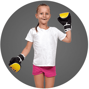 Child wearing boxing gloves and smiling