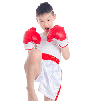 Young boxer practicing kicks
