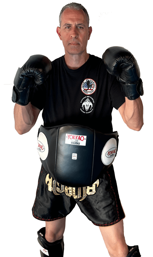 Boxer wearing protective gear, black background